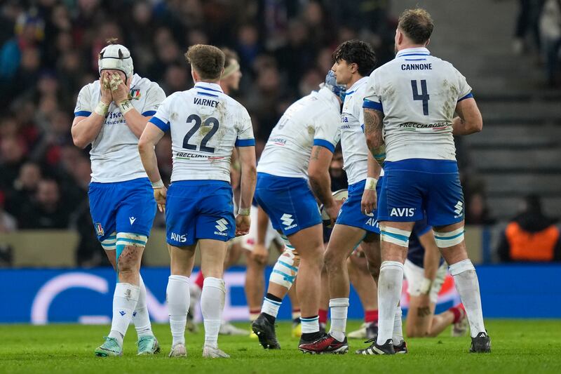 Italy players react at the end of their 13-13 Six Nations draw against France in Lille (Lewis Joly/AP)