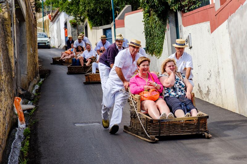 Funchal’s tobaggan rides are not to be missed (Alamy/AP)