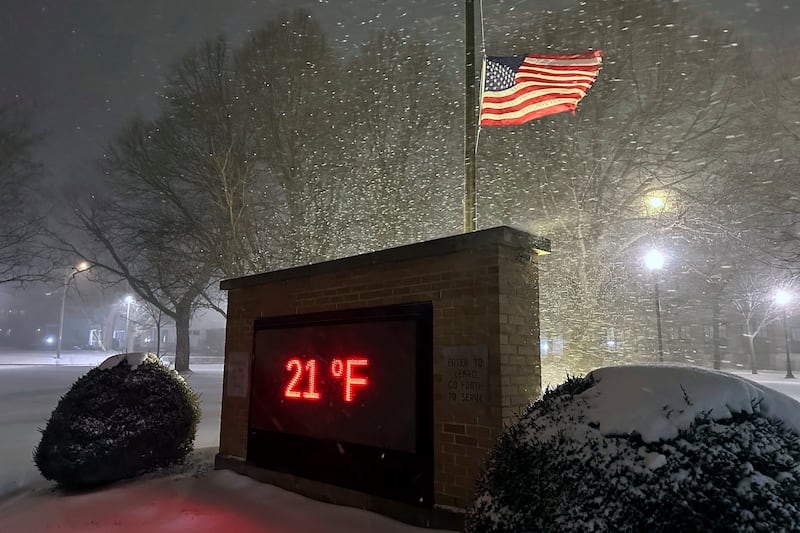 A temperature of 21F (minus 6C) is shown in snowy conditions in Lowville, New York (Cara Anna/AP)