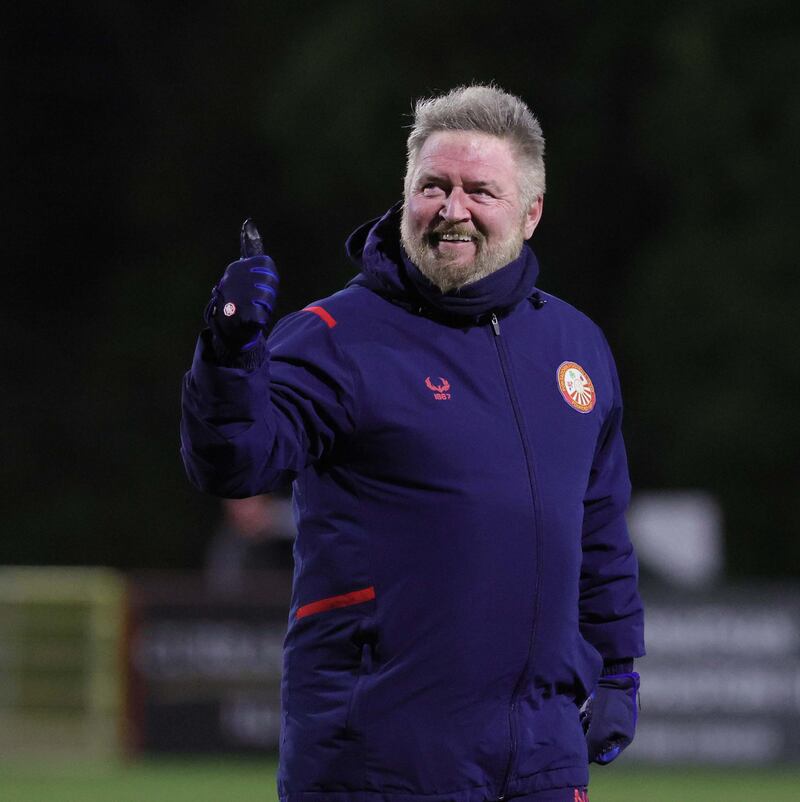 Portadown manager Niall Currie salutes the crowd after his side's hard-earned draw at champions Larne