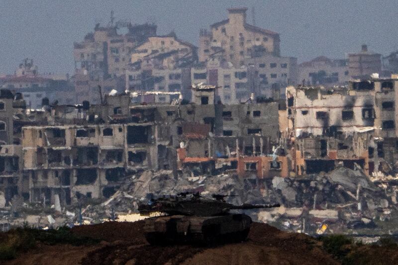 Israeli soldiers on a tank on a position on the border with Gaza Strip (AP)