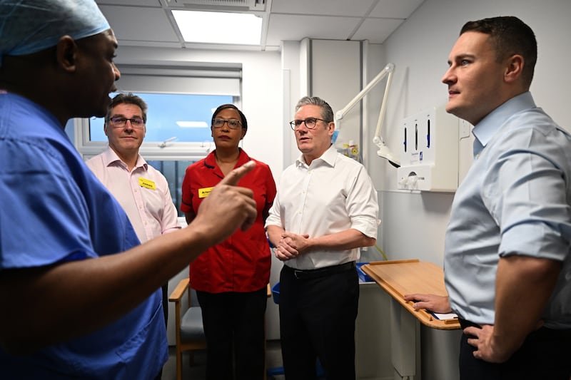 Prime Minister Sir Keir Starmer and Health Secretary Wes Streeting meet members of staff during a visit to the Elective Orthopaedic Centre in Epsom, Surrey