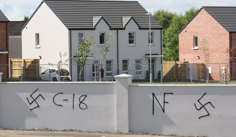 Neo-nazi graffiti had been sprayed on the walls of a new shared housing estate in Antrim last month.