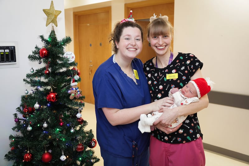 Press Eye - Belfast - Northern Ireland - 25th December 2024 

Christmas babies in Belfast 

Baby boy Scott (7lbs 8oz), born at 1.36am with Midwives Claire Ellis and Laura Finney pictured at the Ulster Hospital, Dundonald on Christmas morning. 

Photo by Kelvin Boyes / Press Eye