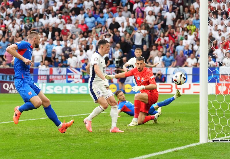 England’s Phil Foden scores before the goal is ruled out for offside during the game against Slovakia.