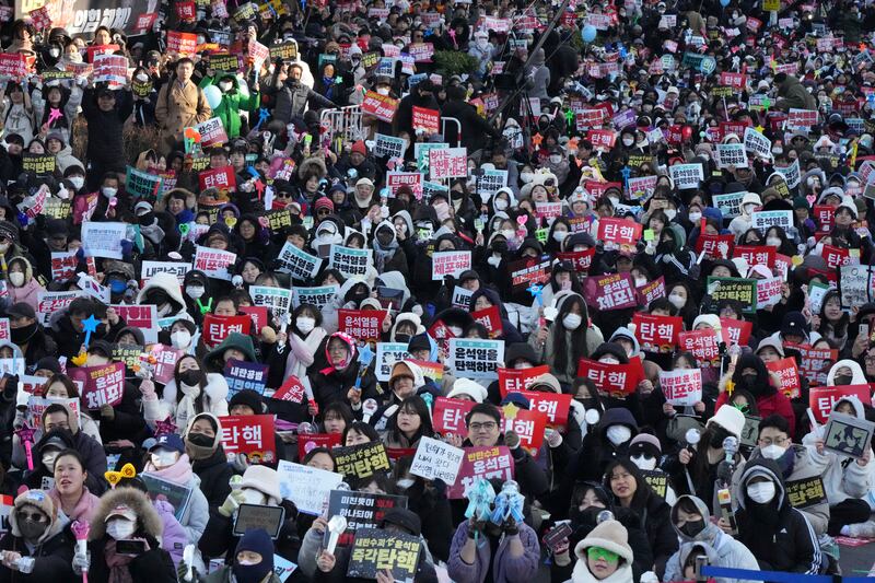 People flooded the streets of Seoul with the news (AP)