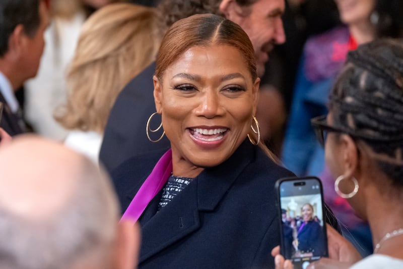 Singer and actress Queen Latifah leaves after a National Arts and Humanities Reception in the East Room at the White House in Washington (Mark Schiefelbein/AP)