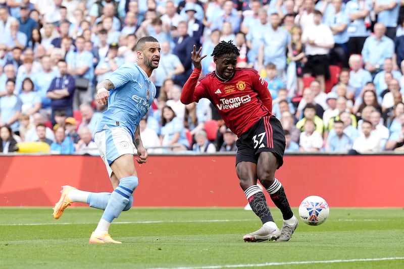 Manchester United’s Kobbie Mainoo scores in the FA Cup final win over Manchester City.