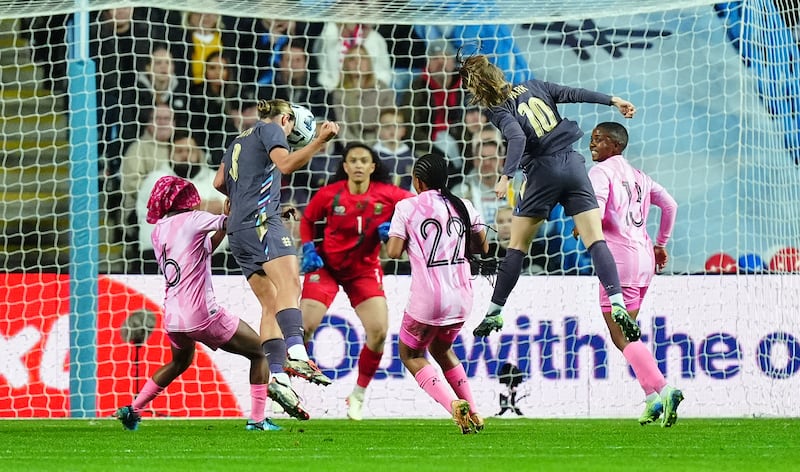 Grace Clinton, second left, scores England’s second goal against South Africa