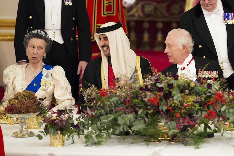 The King with the Emir of Qatar Sheikh Tamim bin Hamad Al Thani and the Princess Royal during the banquet