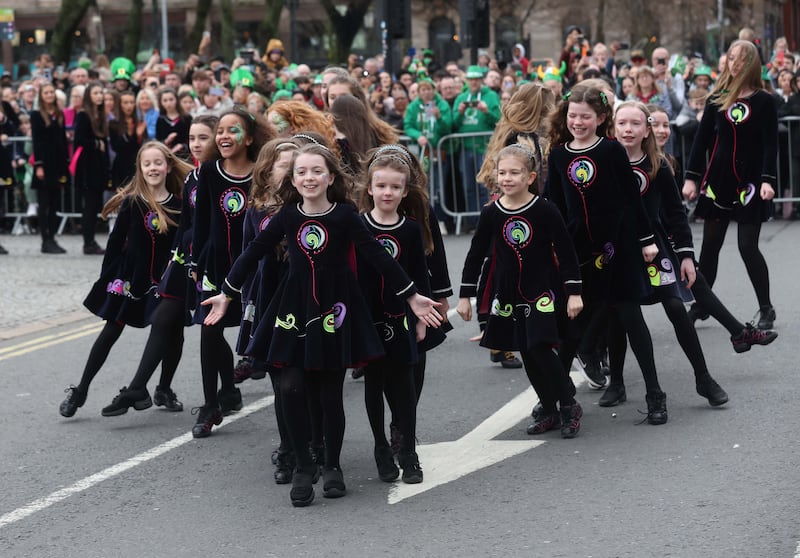 Performers entertain the crowd as  Thousands line the streets for the St Patrick’s day Parade in Belfast on Sunday.
PICTURE COLM LENAGHAN