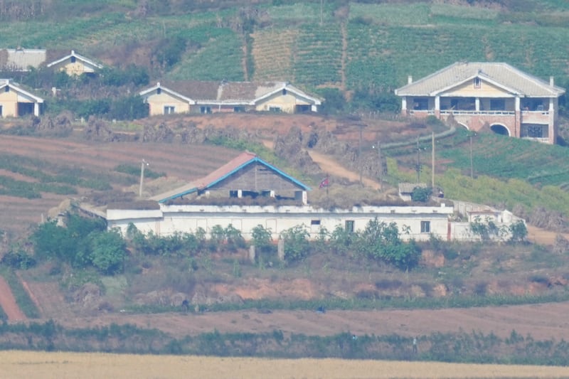 A North Korean flag is seen in North Korea’s town Kaepoong, seen from Paju, South Korea (Lee Jin-man/AP)