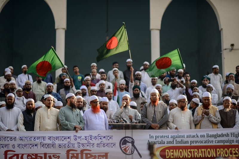 Members of Islami Andolan Bangladesh shout slogans during a protest in Dhaka after Hindus in Agartala stormed a consulate office of Bangladesh (Mahmud Hossain Opu/AP)