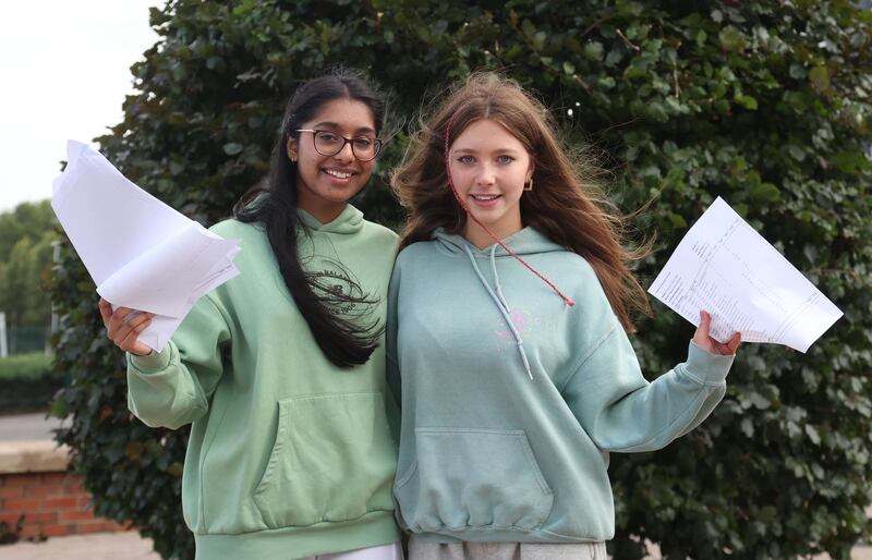 Rayna Roshan and Meghan McSorley   who receive their GCSE results at Our Lady and St Patrick's College Knock.
PICTURE COLM LENAGHAN