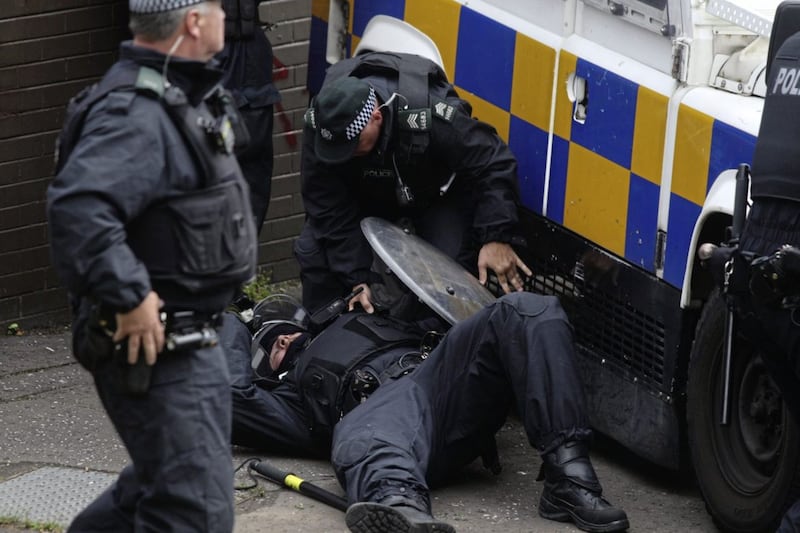 A police officer injured at the New Lodge bonfire stand-off in north Belfast. Picture Matt Bohill 