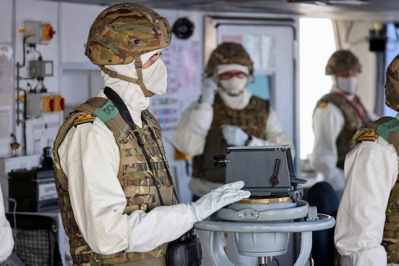 The Officer of the Watch on the bridge of HMS Diamond in the Red Sea