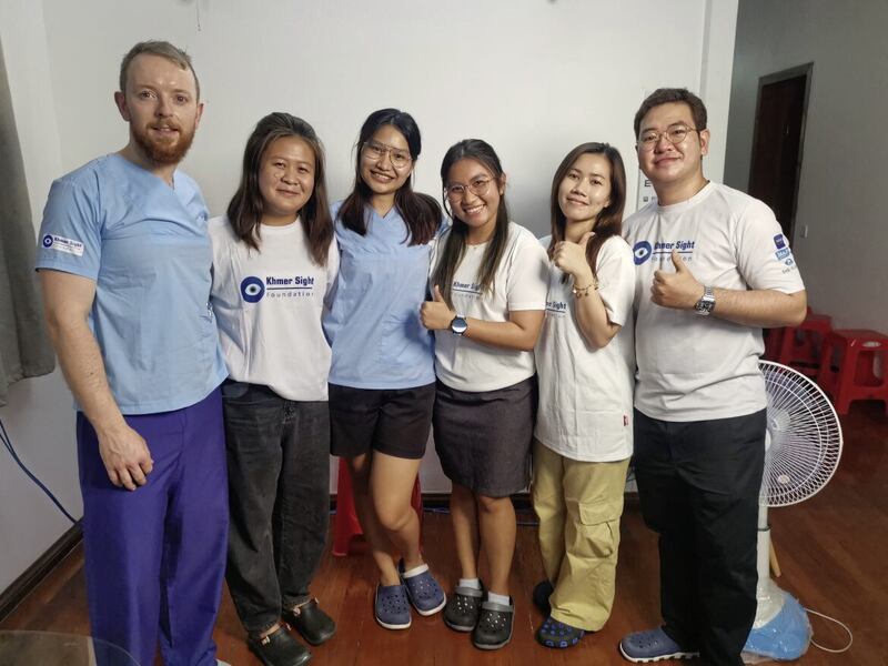Shane Higgins, pictured left, with third and fourth year medical student volunteer staff who helped as interpreters for the sight-saving mission to Cambodia 