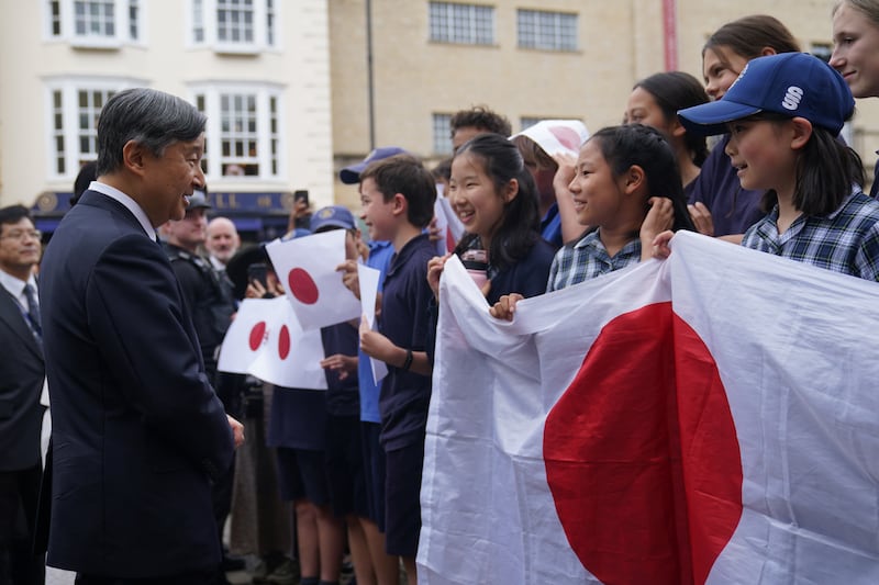 Emperor Naruhito talks to students from Dragon School in Oxford