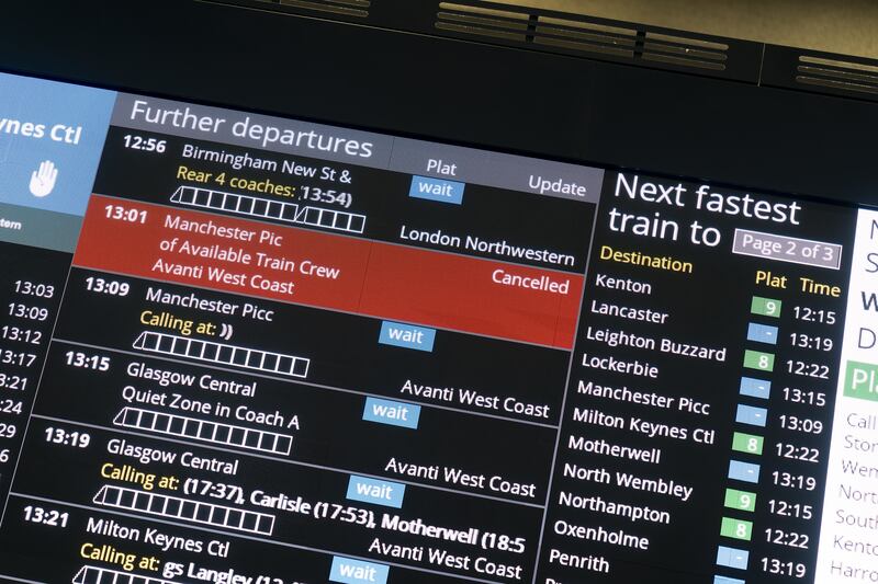 A departures board at Euston station shows delays on the West Coast main line