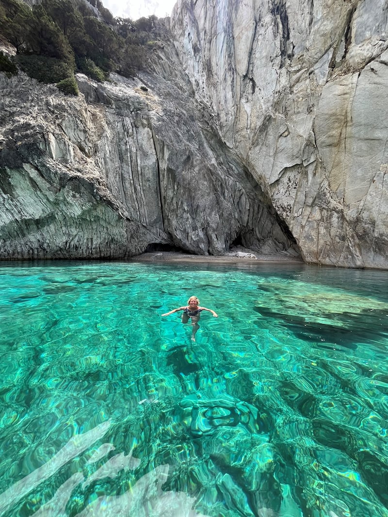 Hannah Stephenson swims from the boat off Meganisi