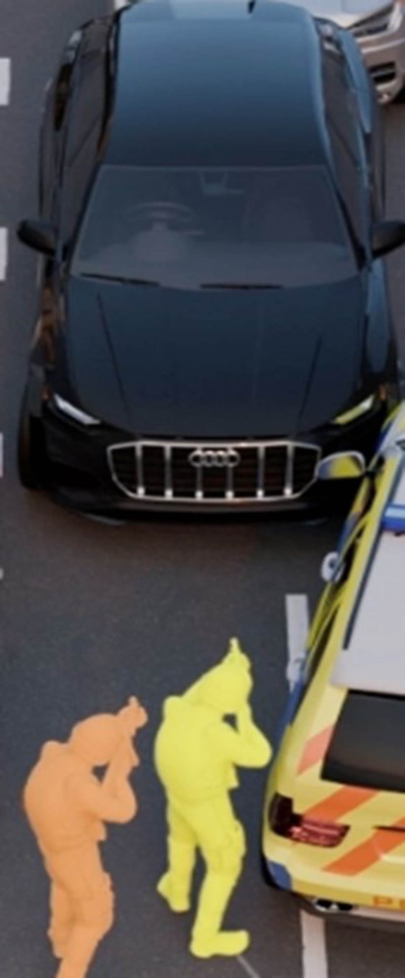 A computer-generated image of the position of Martyn Blake, yellow figure, and another firearms officer, orange, in front of the Audi in which Mr Kaba was shot