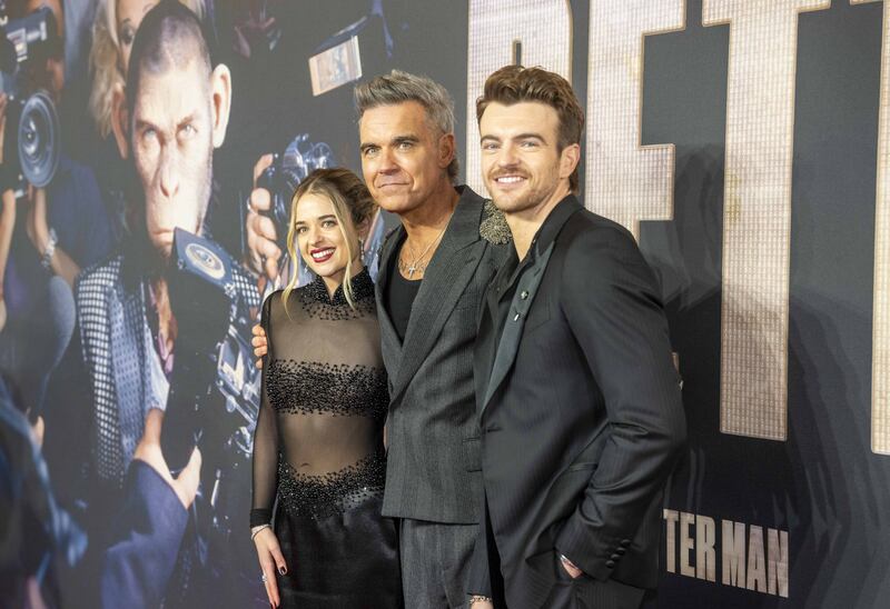 Raechelle Banno, Robbie Williams and Jonno Davies attending the European premiere for Better Man at Odeon Luxe