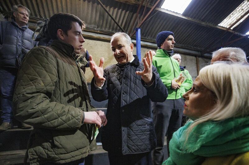 Tanaiste Micheal Martin speaking to young farmer Mark Brady (left) at Ballyjamesduff Co Operative Livestock Mart .