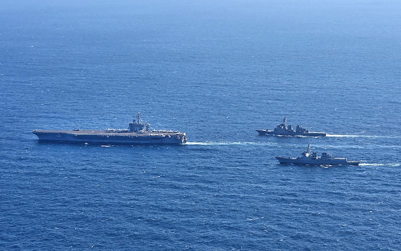 The aircraft carrier USS Carl Vinson, left, sails with the South Korean Navy and Japan’s Maritime Self-Defense Force Aegis off the southern coast of the Korean peninsula during a recent joint drill (South Korea’s Joint Chiefs of Staff via AP)