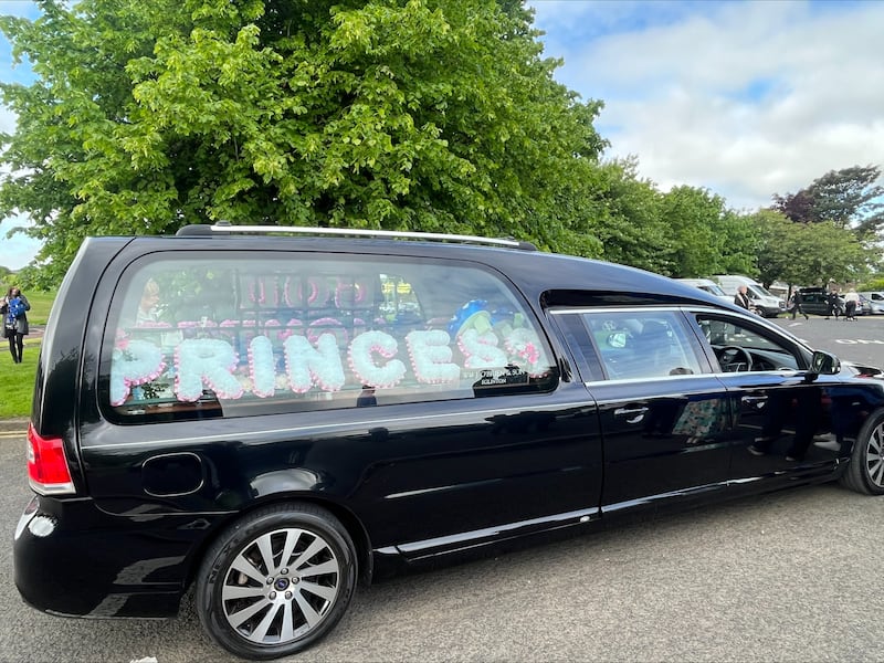 The funeral car for Rebecca Browne outside St Joseph's church, Galliagh Co. Derry. Ms Browne died aged 21 after being hit by a Garda car in Co. Donegal. (Claudia Savage/PA)