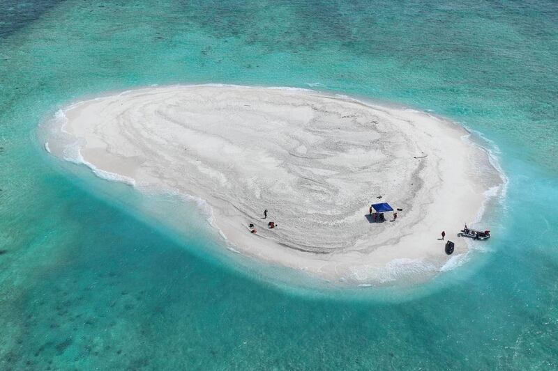 Filipino scientists carried out their research at Sandy Cay (Philippine Coast Guard via AP)