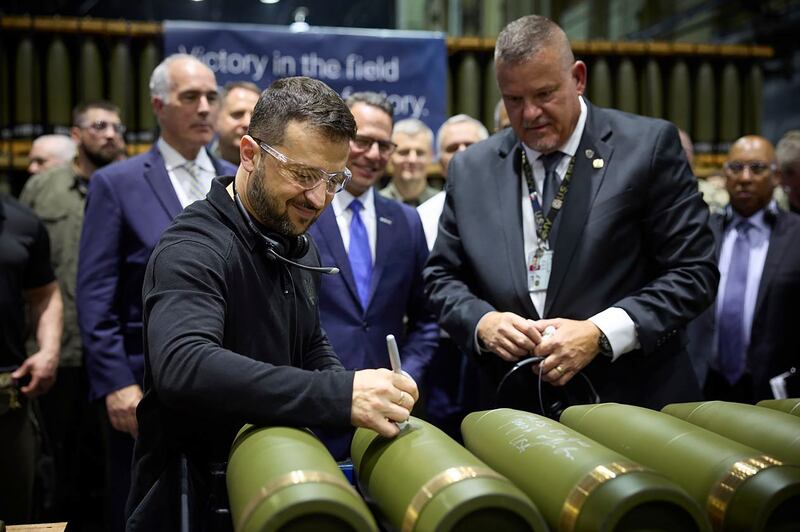 Volodymyr Zelensky is watched by Rich Hansen, the commander’s representative for the Scranton Army Ammunition Plant, while signing military ordnance in Scranton, Pennsylvania (Office of the Ukrainian Presidency via AP)