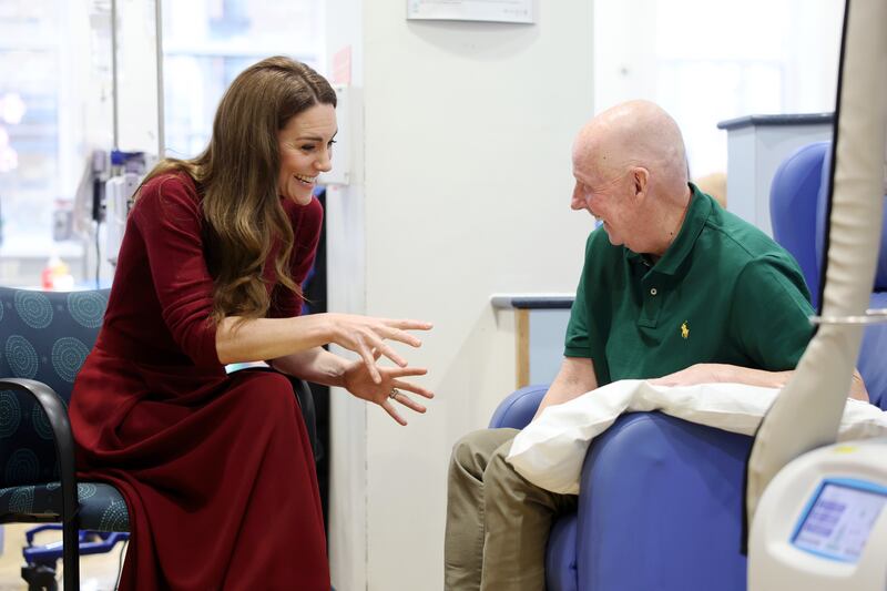 Kate talks with Kerr Melia, who has gastroesophageal cancer, in the treatment room