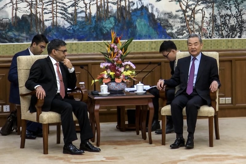 Foreign Minister Wang Yi spoke to his Indian counterpart Vikram Misri during a meeting in Beijing (Phoenix TV via APTN)