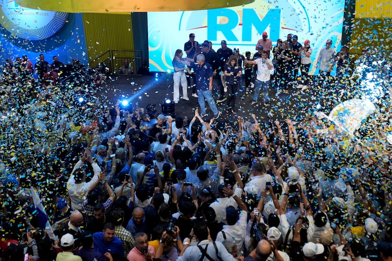 Mr Mulino’s supporters after winning on the day of the general electing in Panama City (Matias Delacroix/AP)