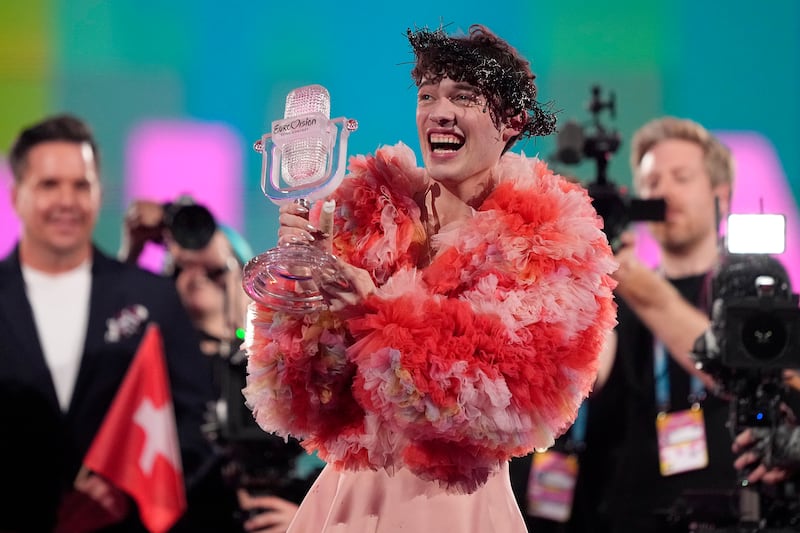 Nemo of Switzerland, who performed the song The Code, celebrates after winning the Grand Final of the Eurovision Song Contest in Malmo, Sweden, Sunday, May 12, 2024. (AP Photo/Martin Meissner)
