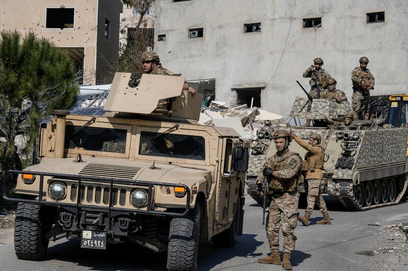 Lebanese soldiers enter a neighbourhood in the southern Lebanese village of Aitaroun (AP Photo/Bilal Hussein)