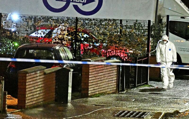 Police forensics experts examine the area around a fatal shooting on the Cliftonville Road in north Belfast. Picture by Alan Lewis