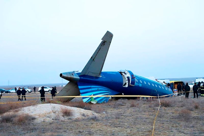 Part of the Azerbaijan Airlines Embraer 190 lies on the ground near the airport in Aktau, Kazakhstan (Administration of Mangystau Region/AP)