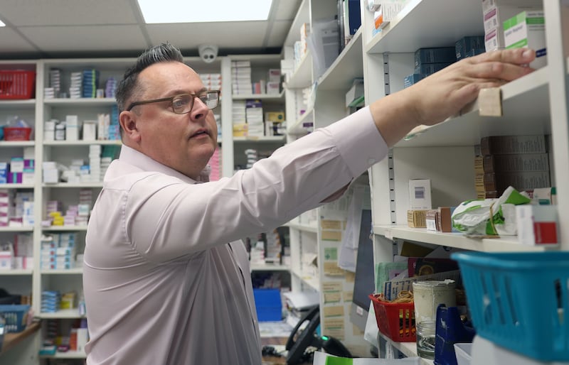 Pharmacy owner Paul McDonagh on the Falls Road in West Belfast speaks to The Irish News.
PICTURE COLM LENAGHAN