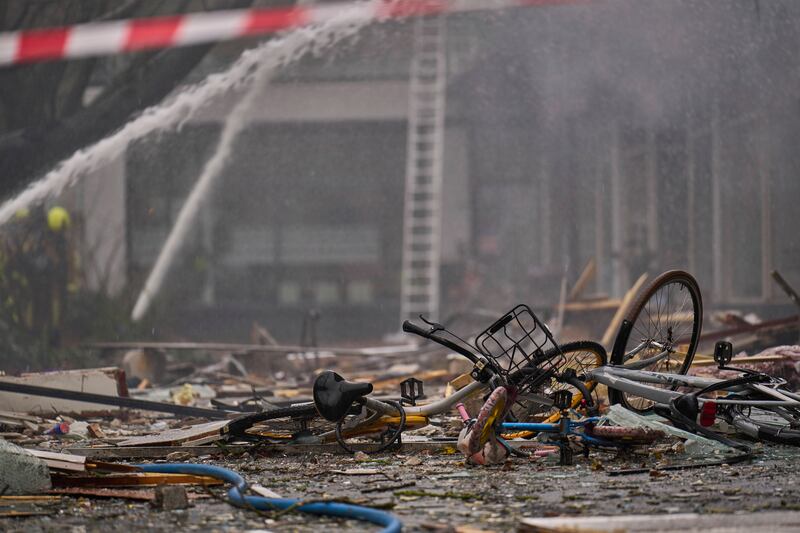 Destroyed bicycles amid the debris at the site of the explosion (Phil Nijhuis/AP)