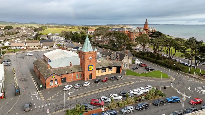 Aerial image of Newcastle's former railway station, a red brick building featuring a spire.