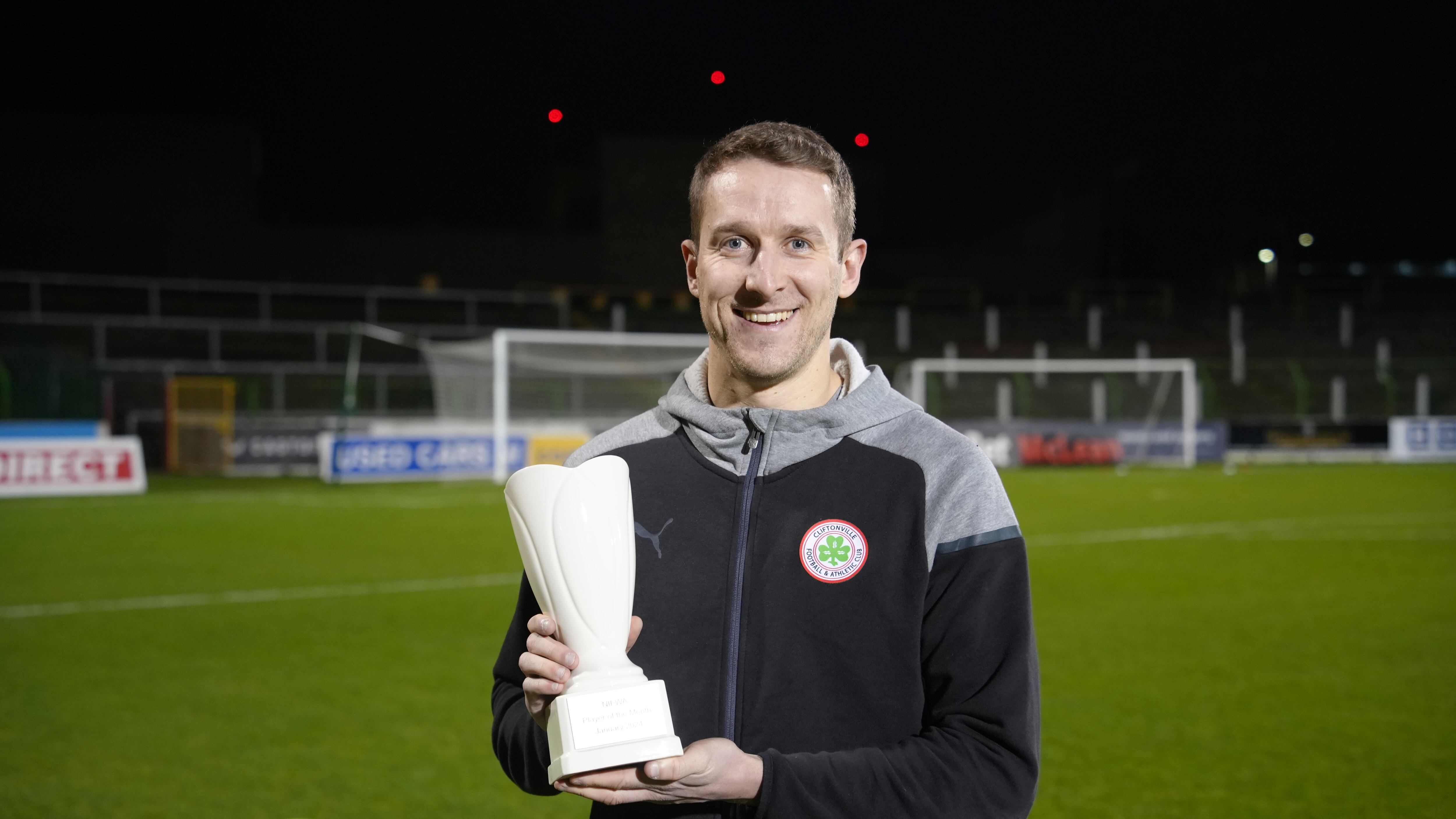 Cliftonville's Jonny Addis with his award after being named Dream Spanish Homes Player of the Month for January