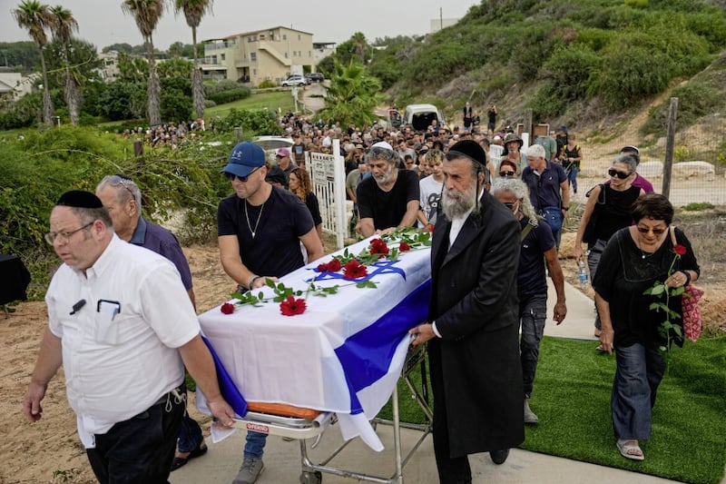 Friends and relatives of Hamas victim Yonat Or carry her coffin during her funeral at Kibbutz Palmachim, Israel 