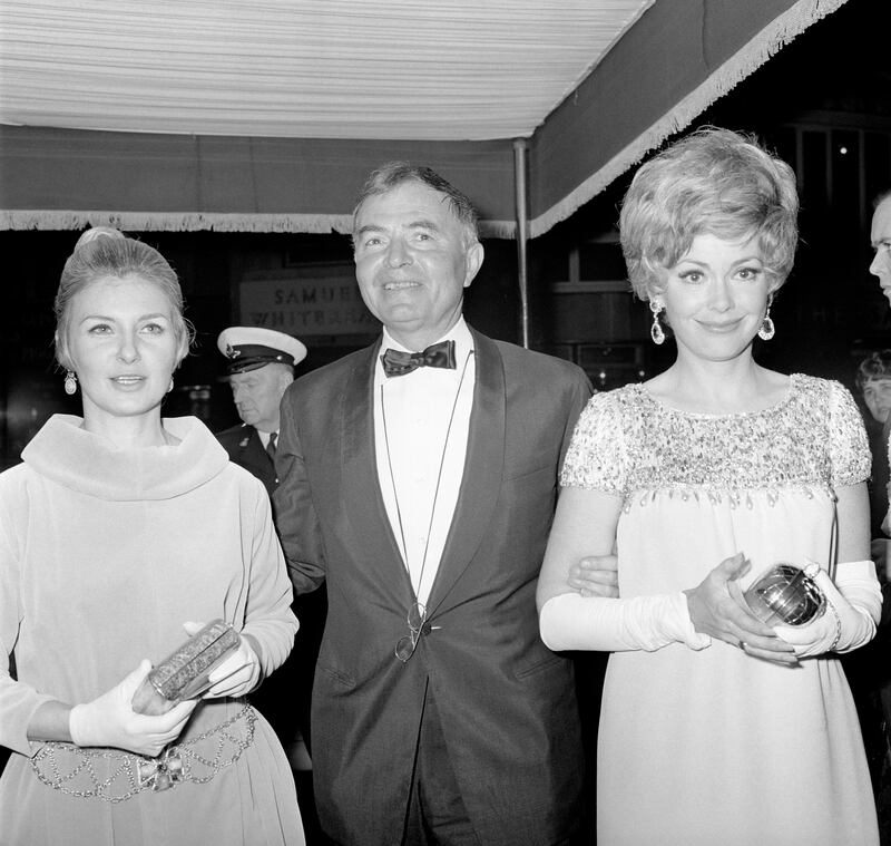 Barbara Rush, right, with actor James Mason, centre, and actress Joanne Woodward, left, at the premiere of the film Mayerling