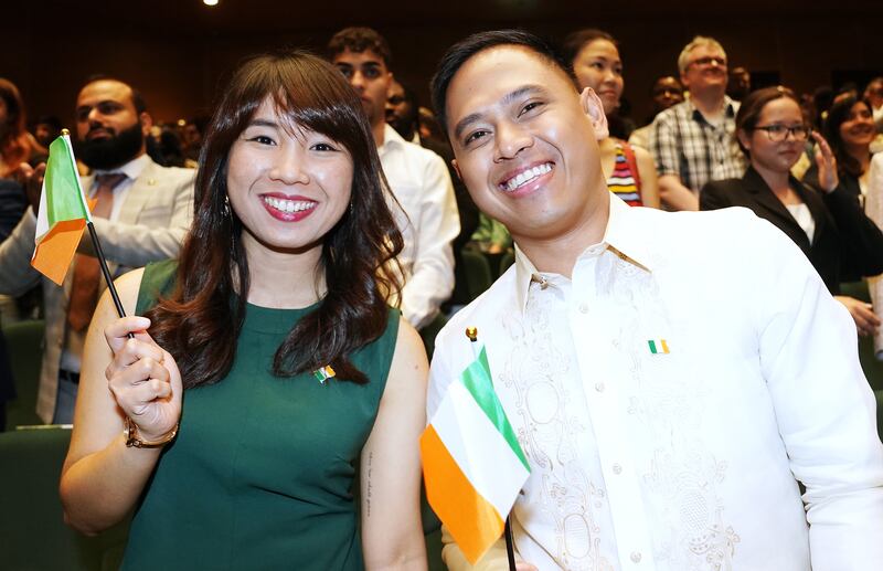 Evangeline Augustia (left) and Zyrone Clem Conde attend a citizenship ceremony at the Convention Centre in Dublin