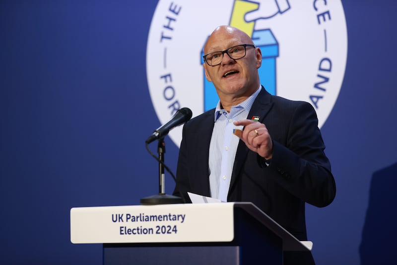 Sinn Fein’s Paul Maskey gives a speech after he retains his seat