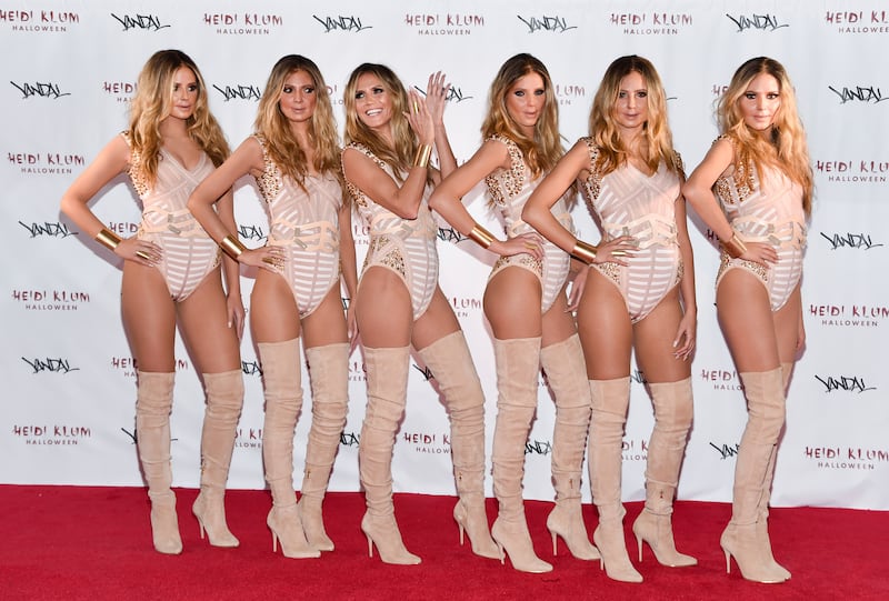 Heidi Klum, third from left, poses with Heidi clones at her annual Halloween party in 2016 (Evan Agostini/Invision/AP)