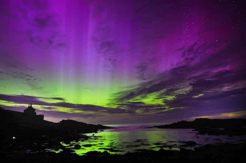 The aurora borealis, also known as the northern lights, fill the sky over the Bathing House in Howick, Northumberland