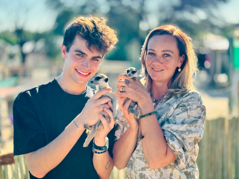 Alma Celeste Stafford and Kyle Thomas in South Africa with his favourite animals, the meerkats, during We Built a Zoo