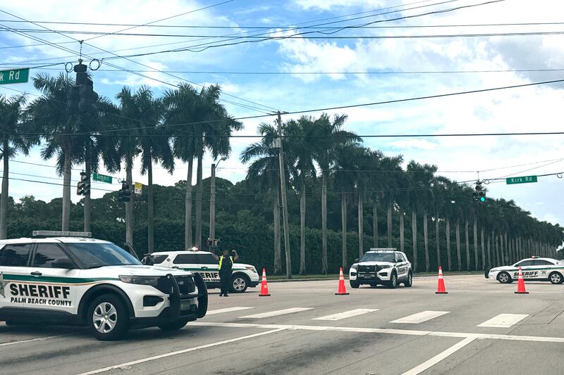 Sheriff vehicles are pictured near Trump International Golf Club (Stephanie Matat/AP)